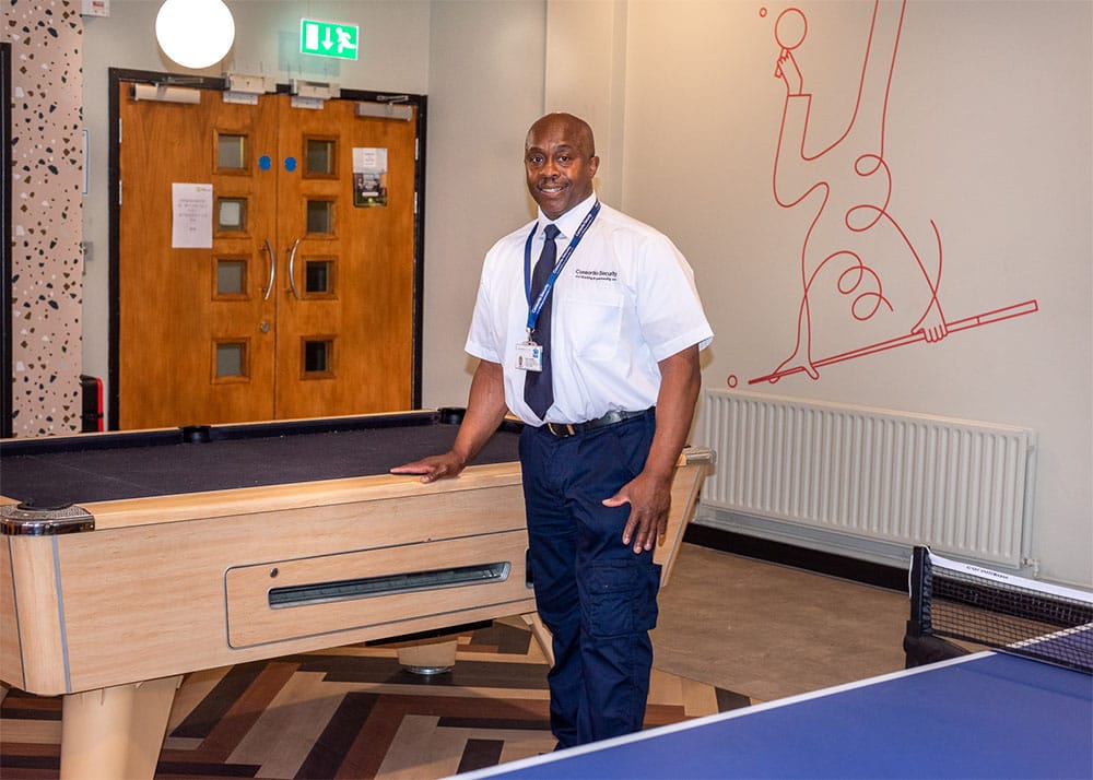 Man by pool table