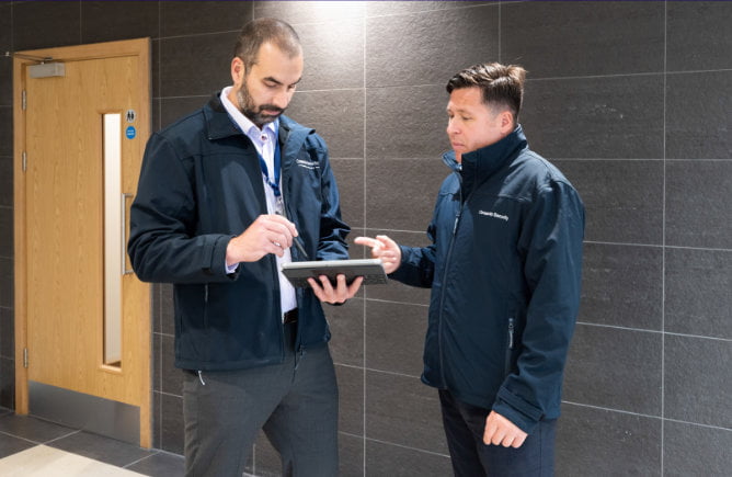 2 people using a tablet