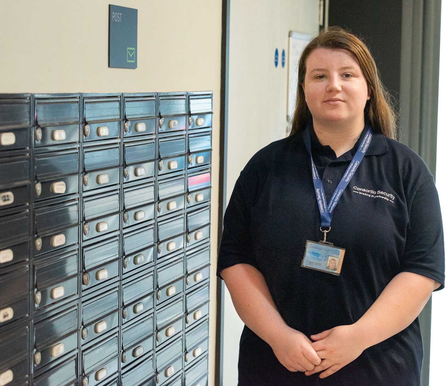 Woman by mail boxes